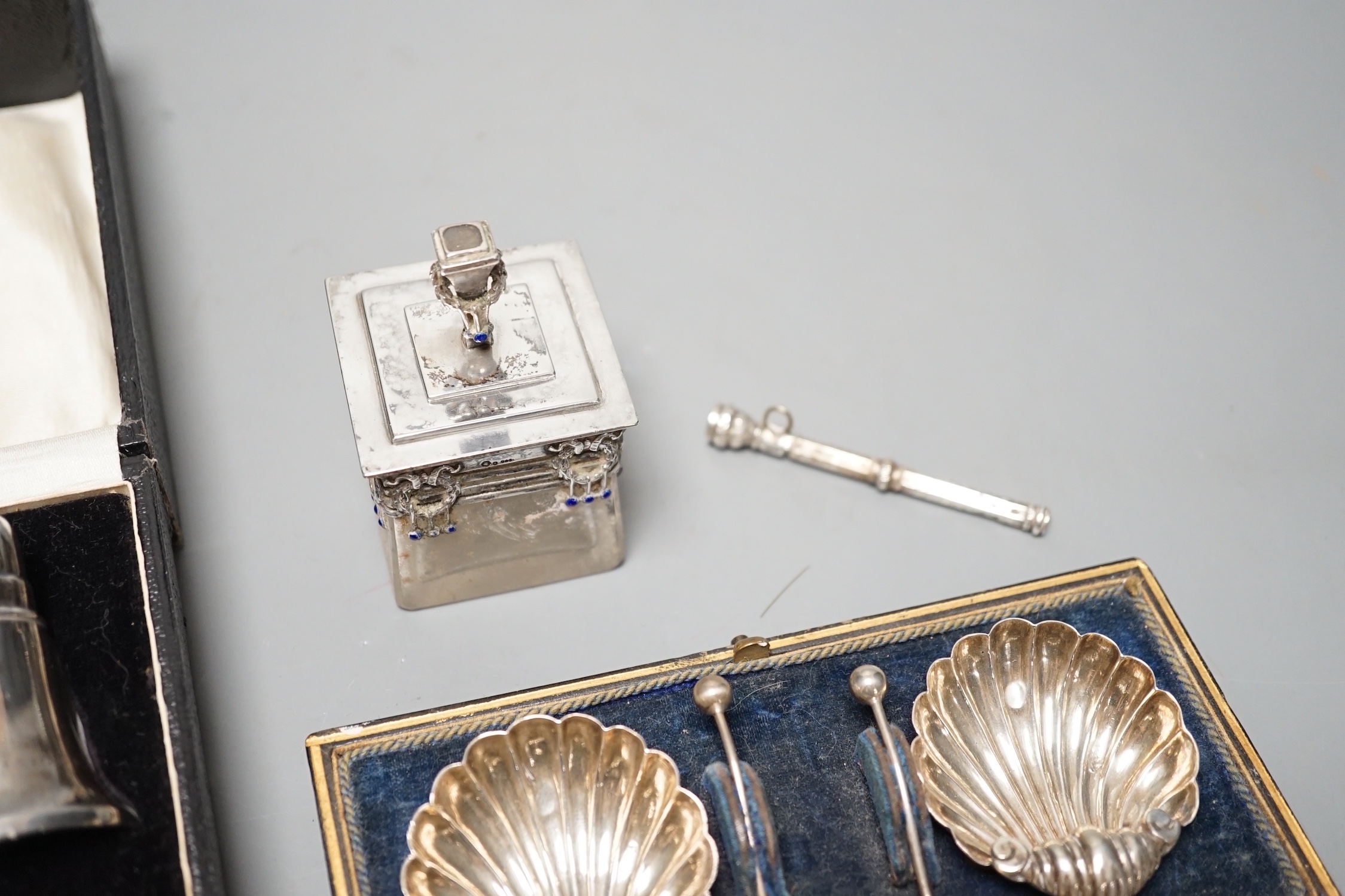 An Austro-Hungarian and enamel mounted glass pot and cover, a cased pair of silver shell salts, a propelling pencil and a cased silver three piece cruet set.